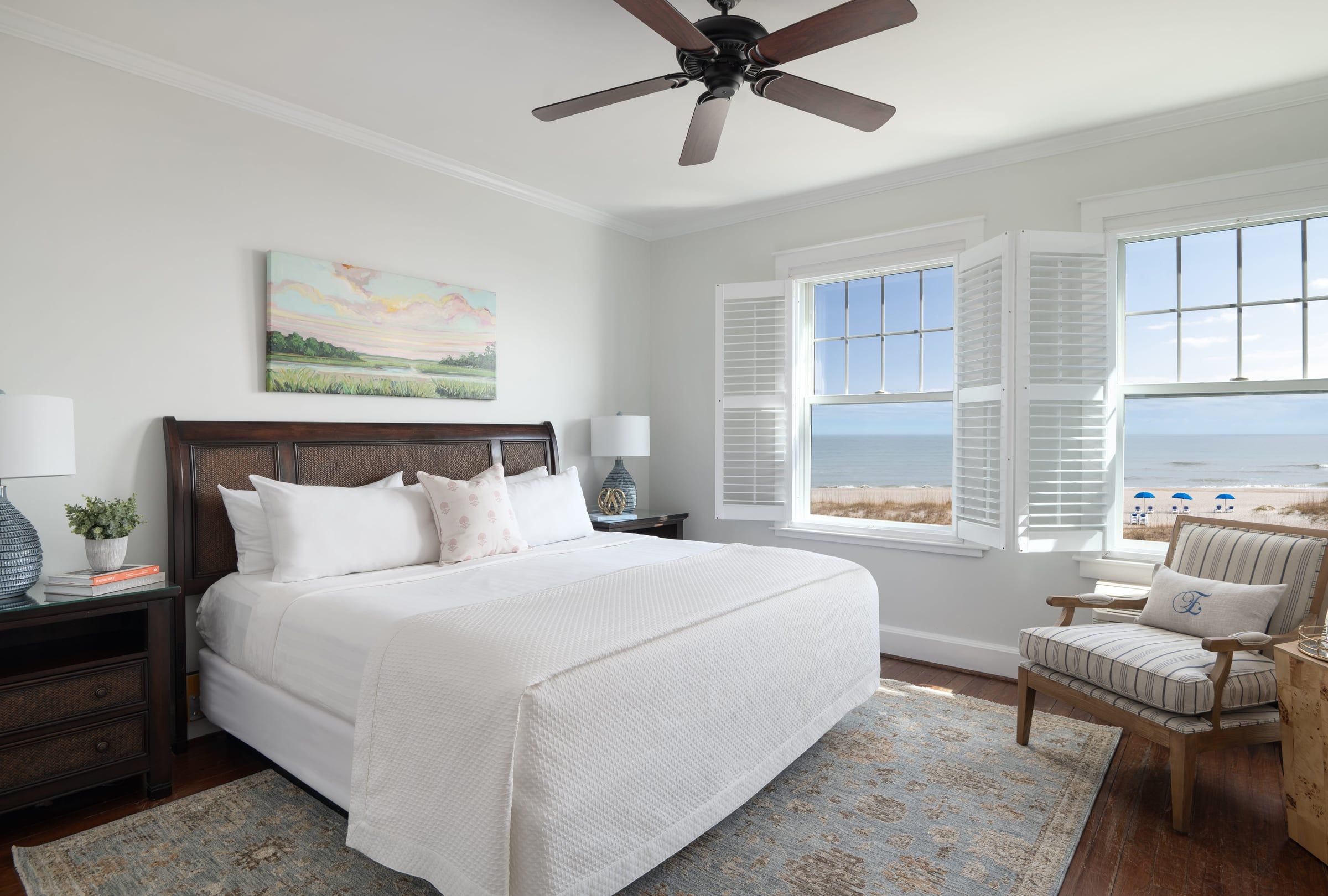 Oceanfront king room at Elizabeth Pointe Lodge with shuttered windows facing the beach