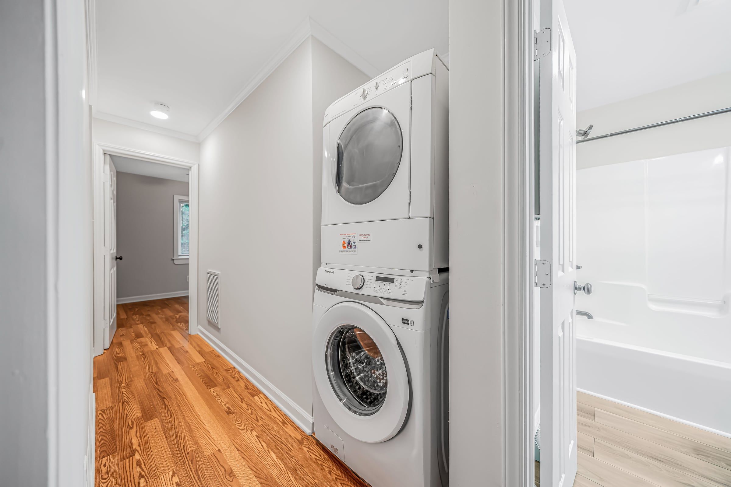 Hallway at The Ramsey with an in-unit stacked washer and dryer